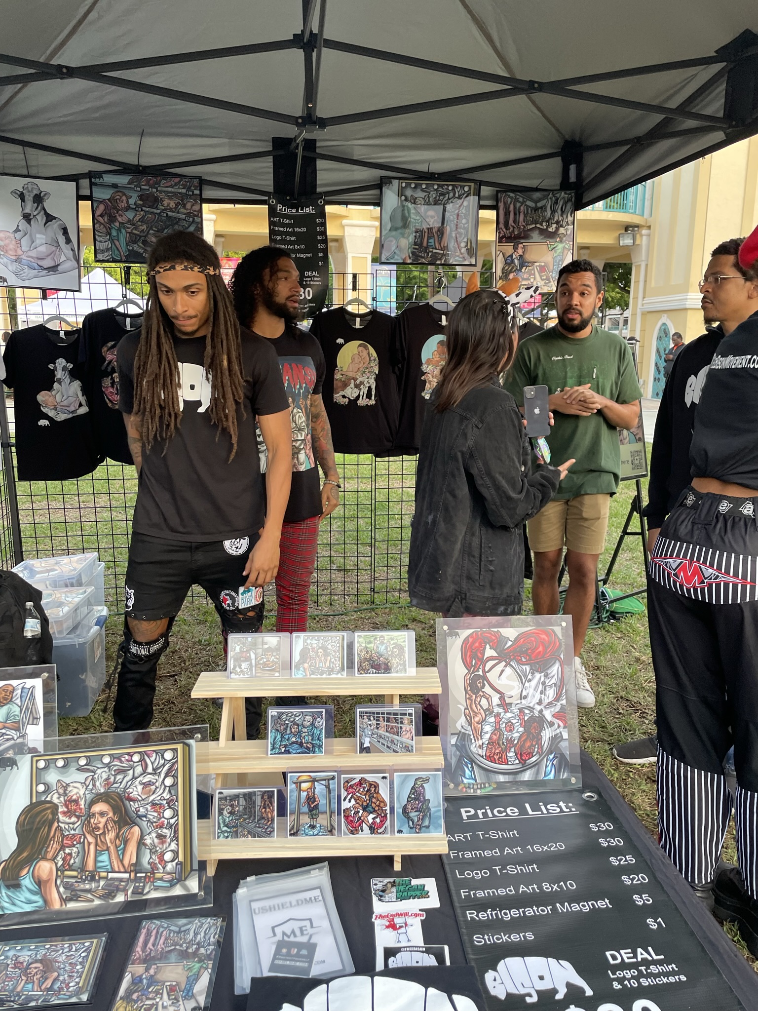 The Bison Movement booth with art prints, merch, and vegan culture conversations