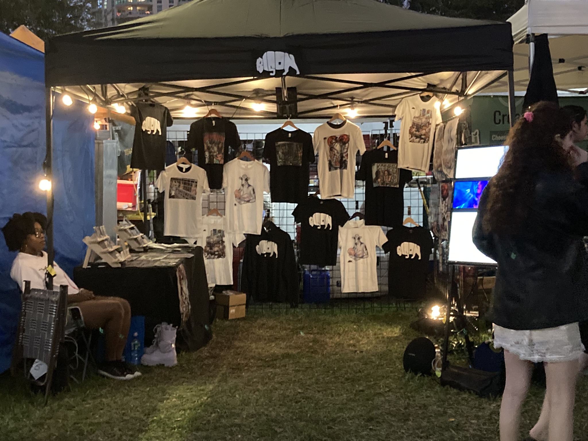 The Bison Movement festival booth with vegan art and merch